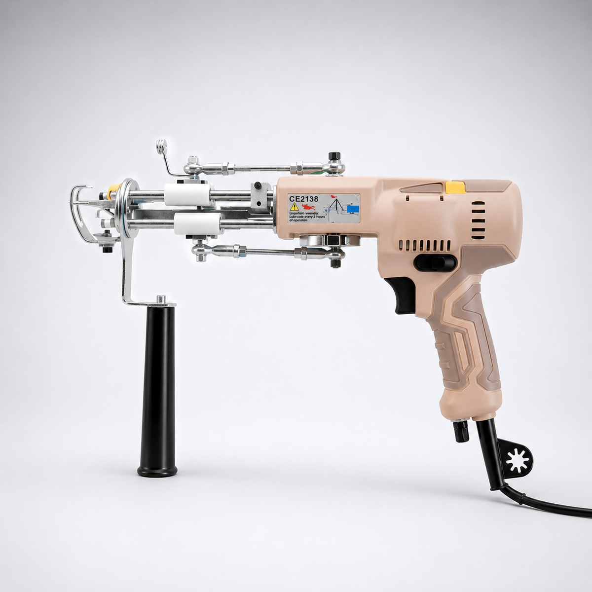 AK-V 2-in-1 tufting gun in Pink Blossom held mid-use at Cheeky Studio, Hackney Wick — honest review by UK Tufting