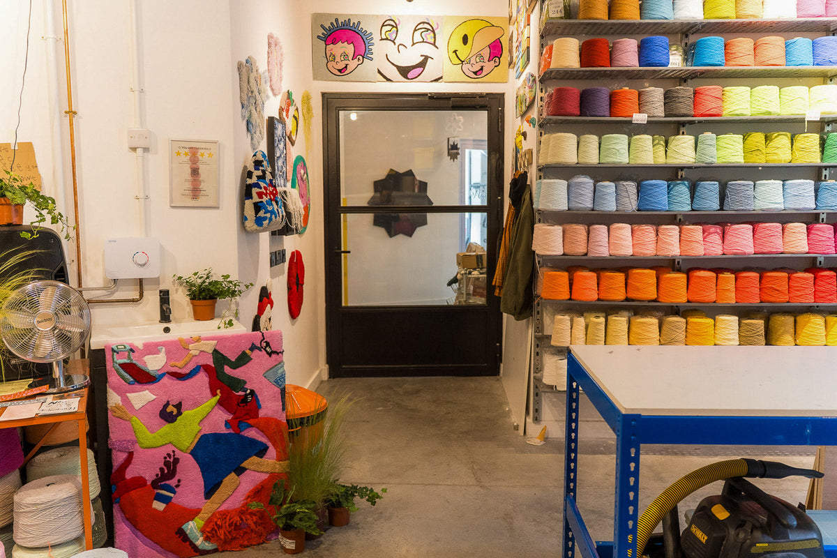 Tufting supplies laid out at UK Tufting studio in Hackney Wick, East London — guns, yarn, frames and accessories