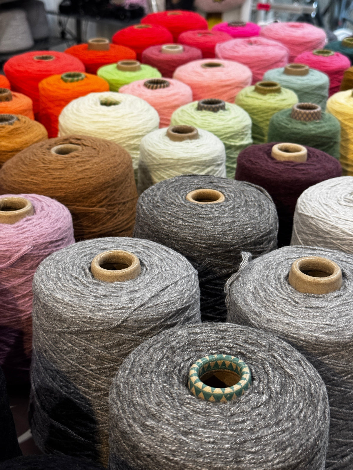Colourful tufting yarn cones for rug making — beginner's yarn guide by UK Tufting