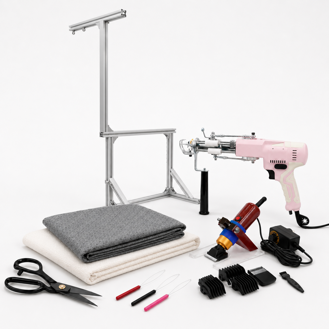 All-in-One Tufting Starter Kit laid out flat — AK-V gun, frame, fabric, trimmer, scissors and threaders by UK Tufting