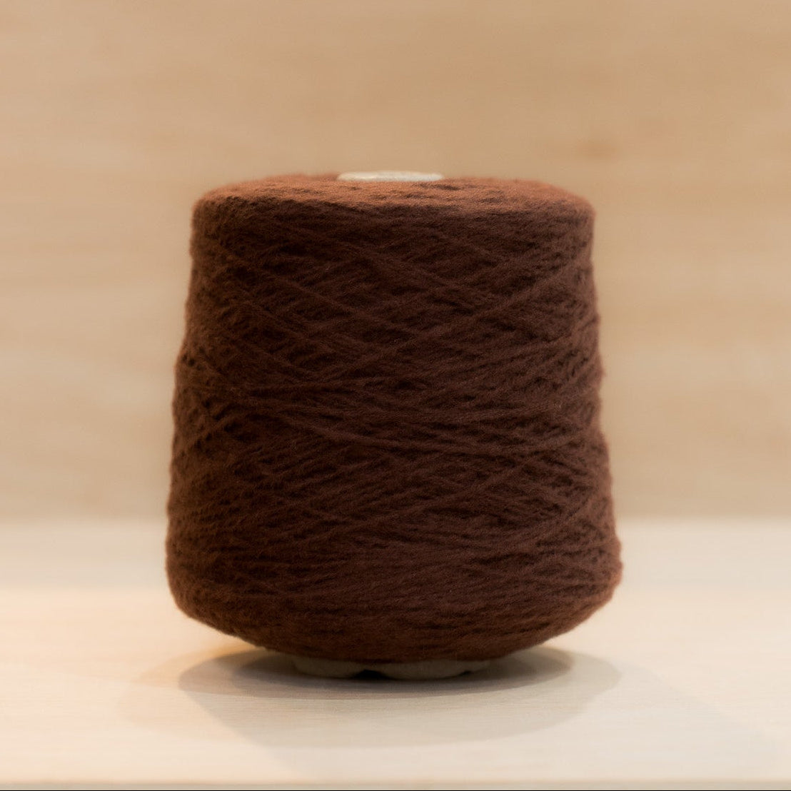 Cheekyarn Loop 8 yarn cone in Flat Cola, a deep warm brown