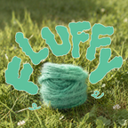 Mint green Loop 8 recycled polyester yarn on grass with bold fluffy text, showcasing soft super bulky yarn for creative craft projects