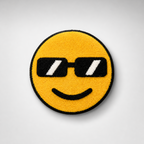 Handmade tufted emoji rug with black sunglasses and a smiley face on a soft yellow background
